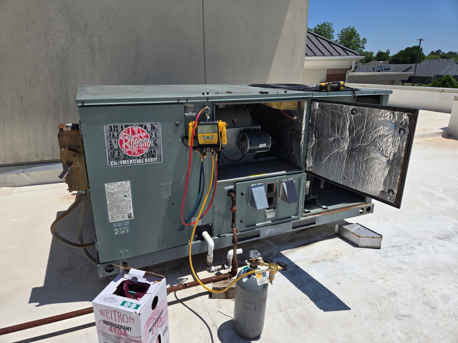 Rheem commercial rooftop HVAC unit service call near Tulsa